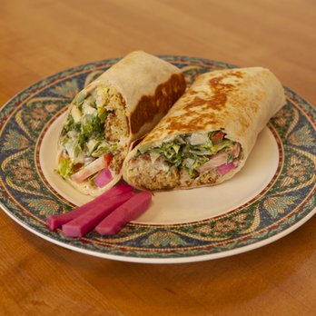 The Mediterranean Market and Cafe signature dishes  Chicken Shawarma Sandwich, Gyro Sandwich, Hummus, Falafel, Baklava.